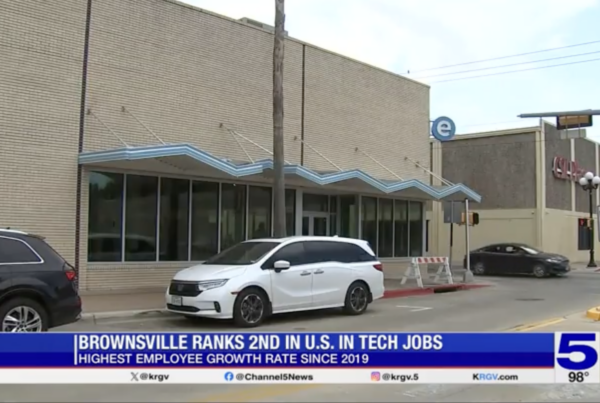 Exterior view of a building in Brownsville, Texas, with a news headline stating, "Brownsville ranks 2nd in U.S. in tech jobs, highest employee growth rate since 2019," as reported by KRGV Channel 5 News.